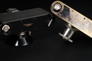 Picture of Leica II (Model D) SN 115 184 (1933), engraved “Sold by James A Sinclair & Co. Ltd. 3 Whitehall London S.W.I.” (Leica dealer in England) & Leica I (Model C) SN 46237 (1930), engraved “Sold by James A Sinclair & Co. Ltd. 9 & 10 Charing Cross London S.W.I.” 