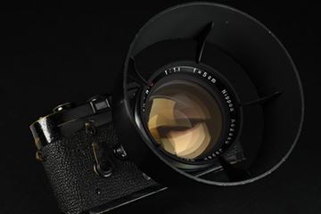 Picture of M3 SN 1 097 777 (1964), with Nikkor 1,1/50 in original Leica screw mount; bayonet adapter; and Nikkor metal lens hood