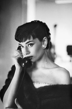 Picture of Audrey poses with a phone, Paramount Studios, 1953
