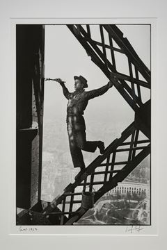Picture of Painter on the Eiffel Tower, Paris, 1953